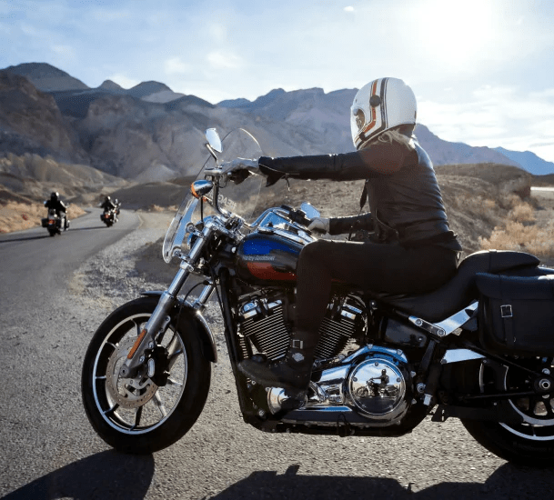 Woman riding her motorcycle covered by motorcycle insurance