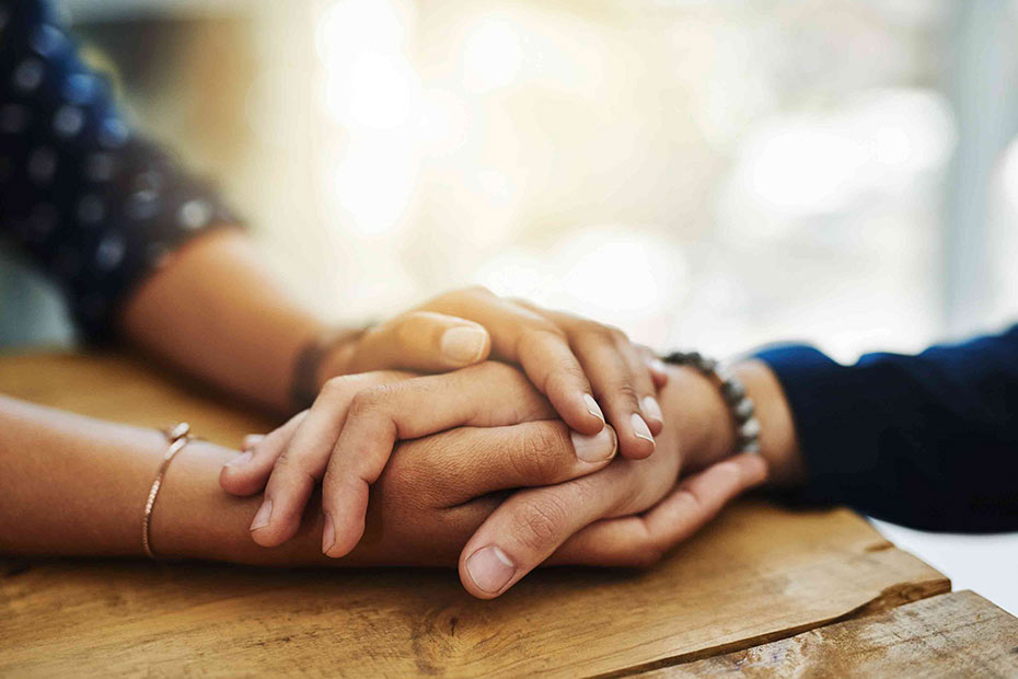 A woman helping a friend during a challenging time