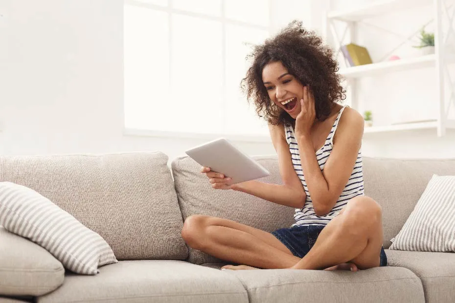 Surprised woman looking at tablet
