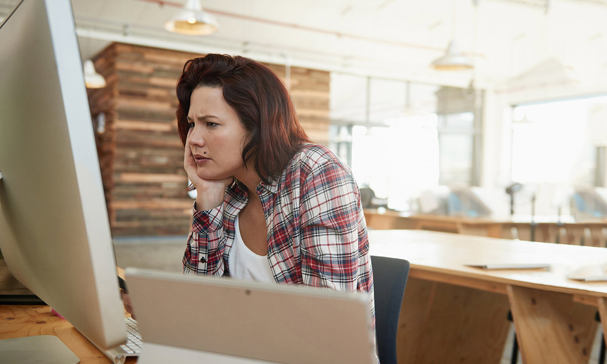 Woman looking at a computer.