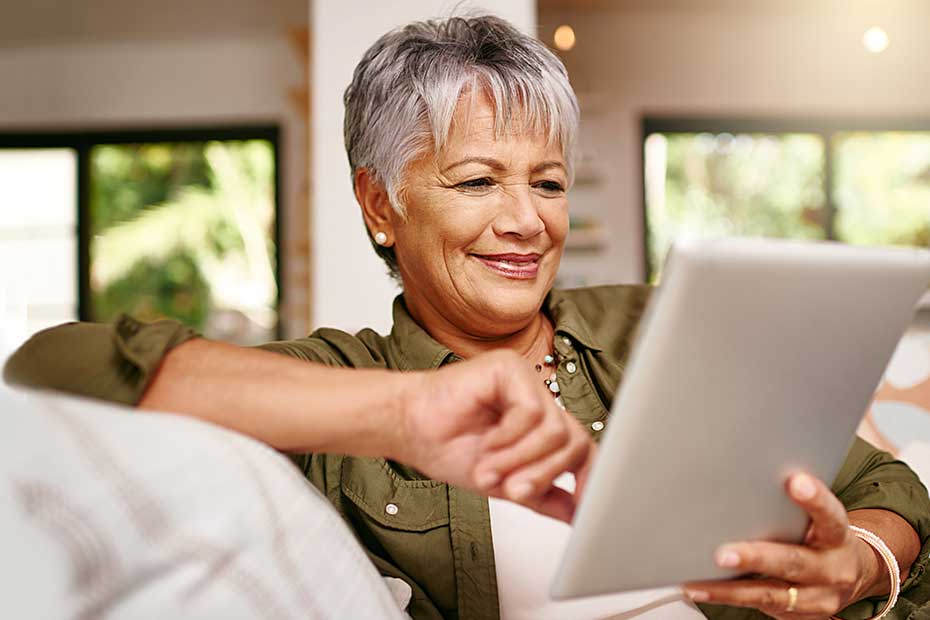 Lady using ipad while comparing Segregated Funds to Mutual Funds