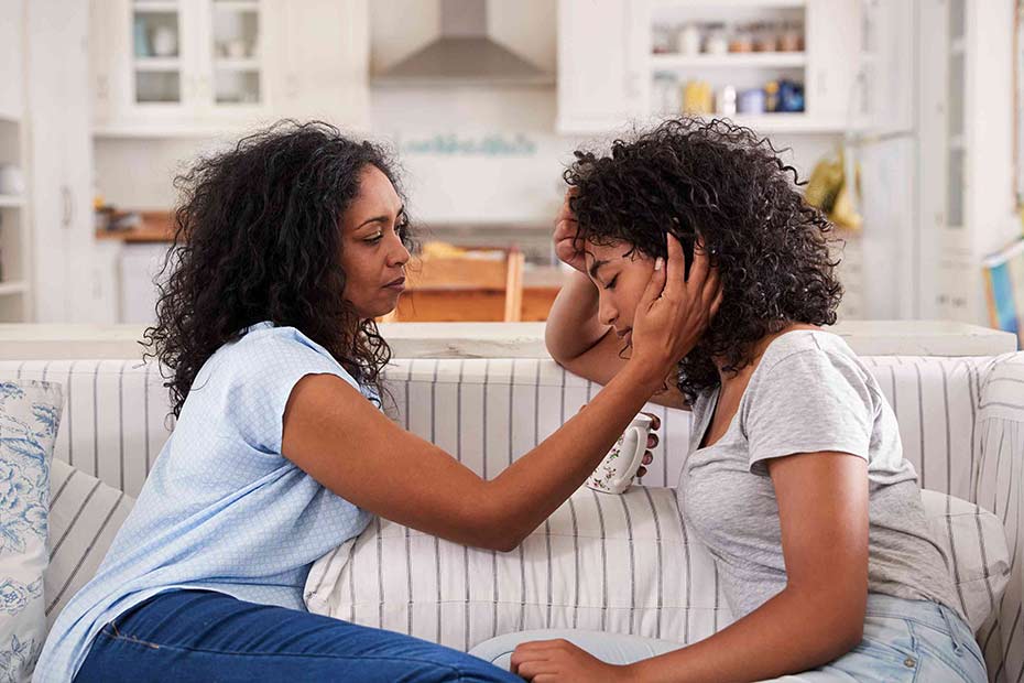 A parent having a conversation with her child