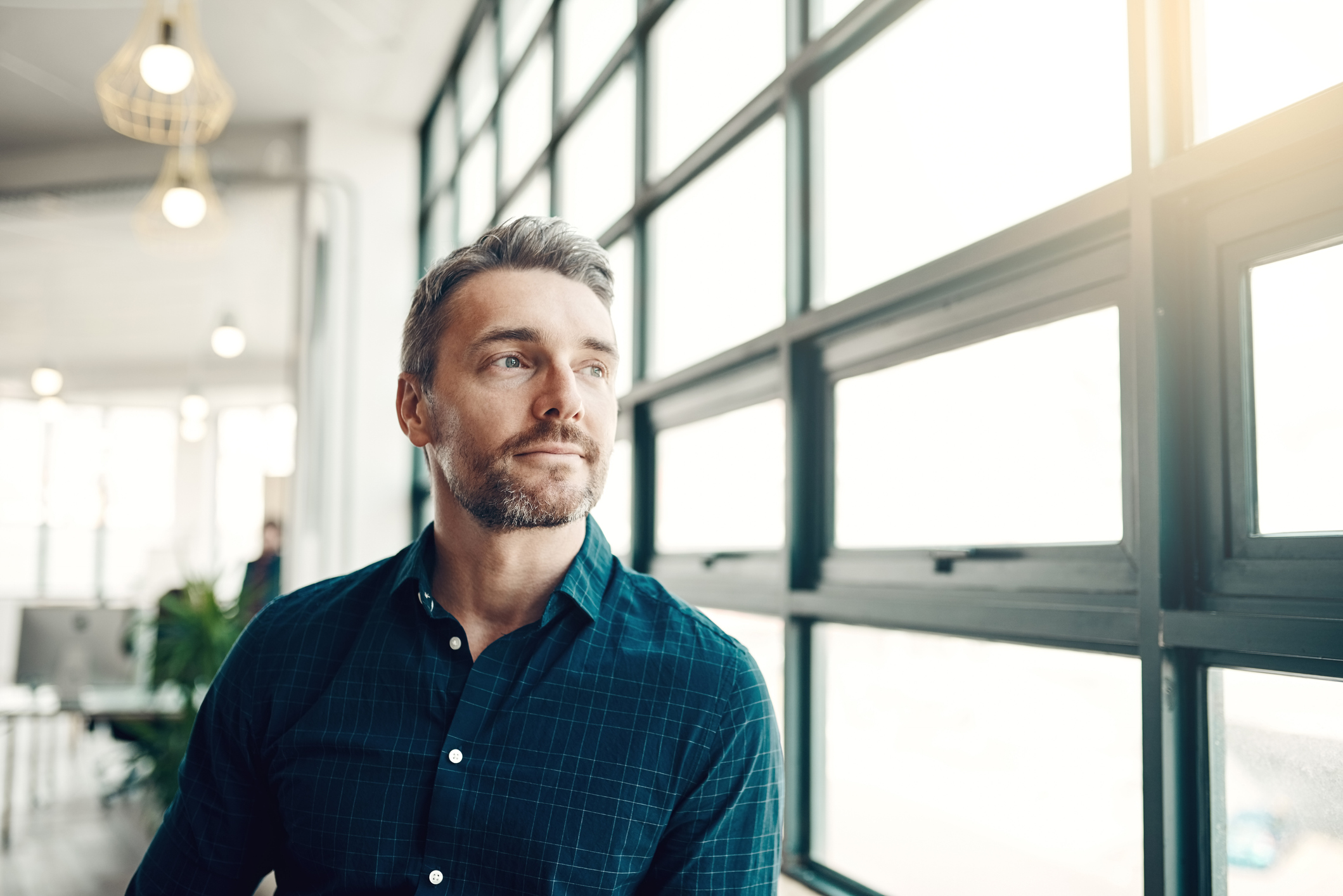 A man staring out of a window