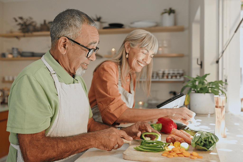 A senior couple cooking together